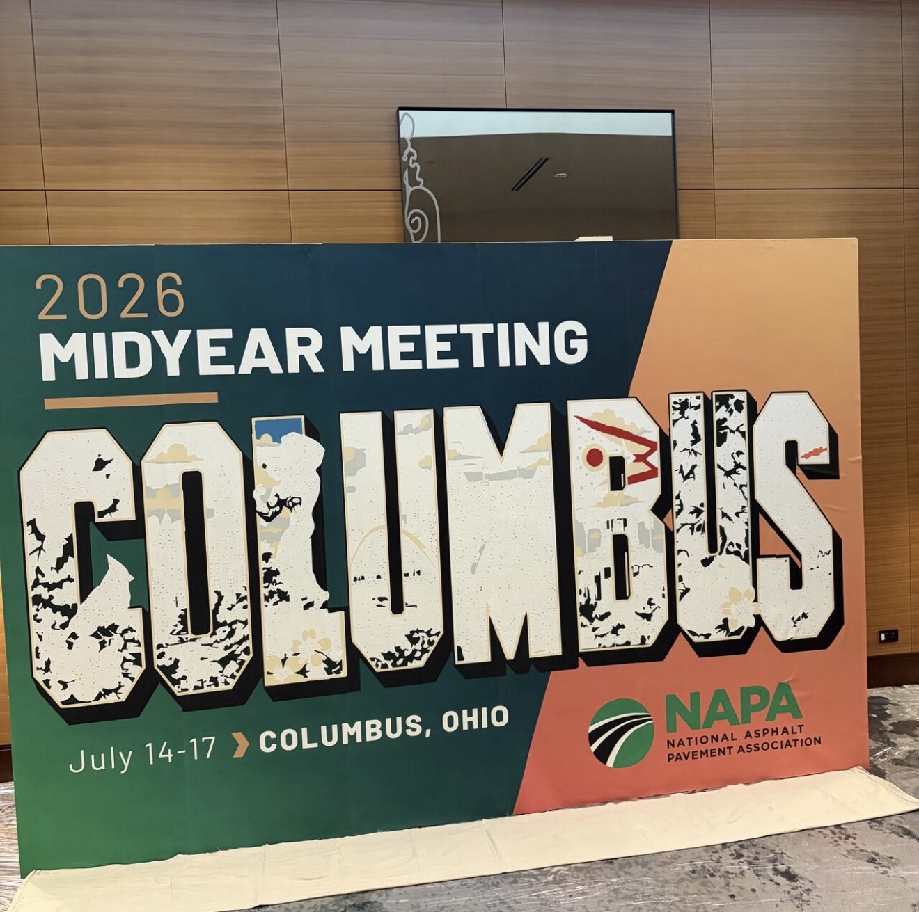 Large sign announcing the 2026 Midyear Meeting in Columbus, Ohio, with the word 'GLOBLOCKS' and the NAPA logo.